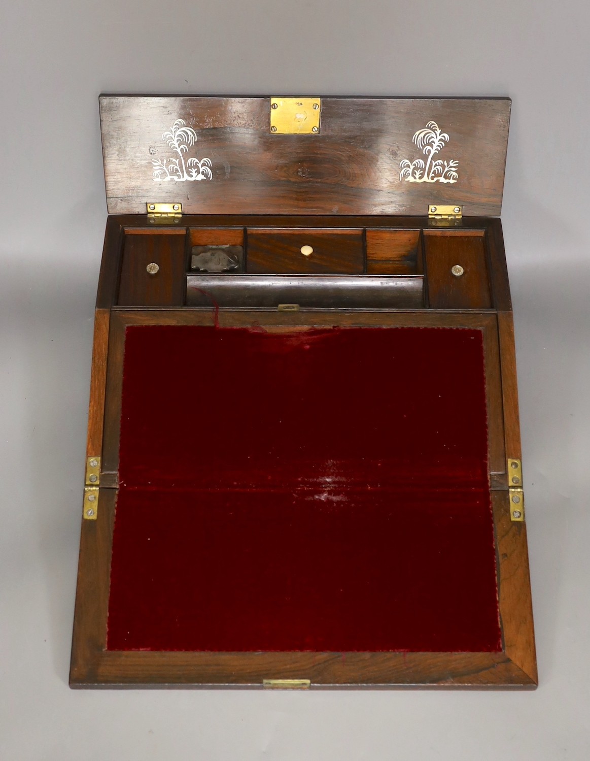A 19th century rosewood veneered, mother of pearl inlaid writing slope, 35cms wide x 26cms deep